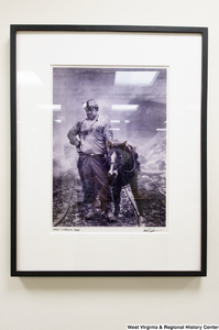 ["A photograph of a coal miner and a small horse hangs on a wall in Senator John D. (Jay) Rockefeller's office."]%