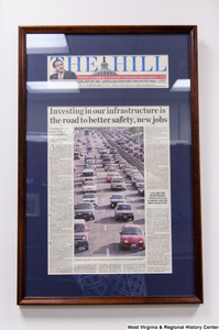 ["A framed Hill article titled \"Investing in our infrastructure is the road to better safety, new jobs\" hangs in Senator John D. (Jay) Rockefeller's office."]%
