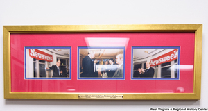 ["Photographs of Senator John D. (Jay) Rockefeller visiting Newsweek hang in his office."]%