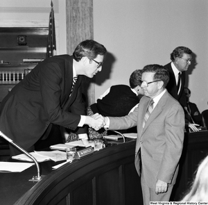 ["Senator John D. (Jay) Rockefeller shakes hands with the president of Colgan Airways following a hearing of the Senate Committee on Commerce, Science, and Technology. Colgan Airways has just merged with New York Air to create New York Air Connection, which will begin serving airports in Morgantown, Elkins, and Benedum with connections to Dulles Airport in Washington."]%