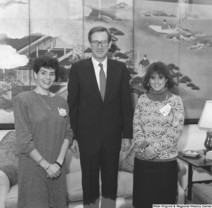["Senator John D. (Jay) Rockefeller stands between to participants in the National Young Leaders Conference in his office."]%