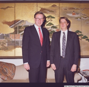 ["This color photograph shows Senator John D. (Jay) Rockefeller standing next to an unidentified young man in his office."]%