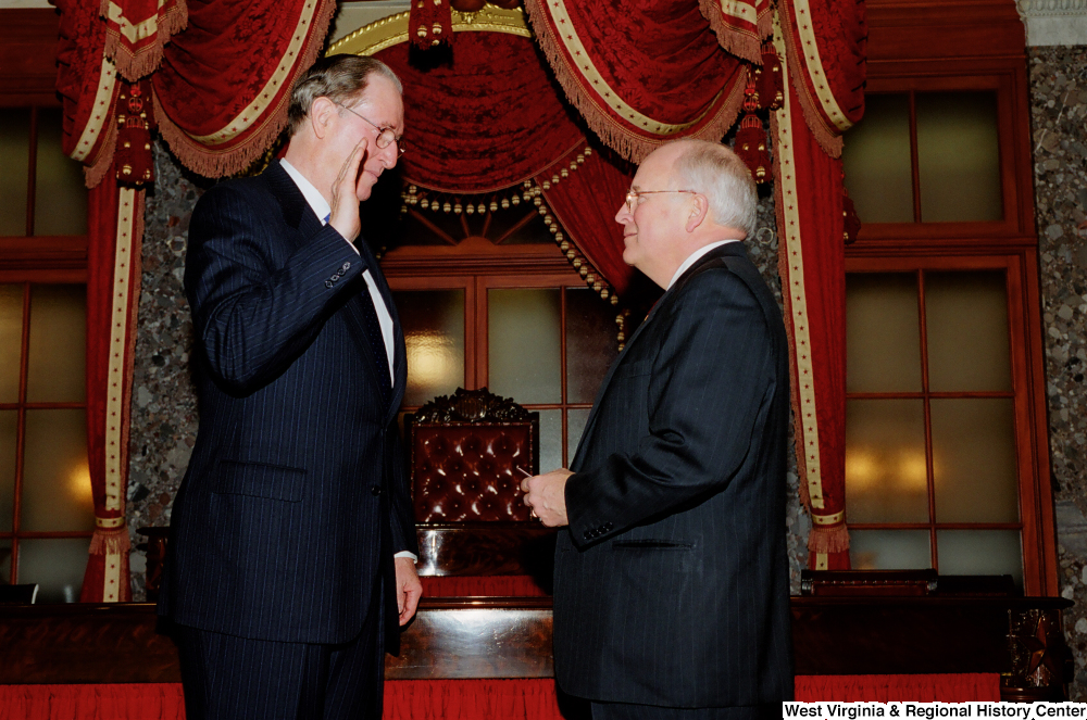 ["Vice President Dick Cheney administers the oath of office to Senator John D. (Jay) Rockefeller."]%