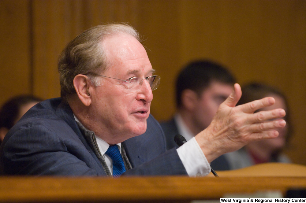 ["Senator John D. (Jay) Rockefeller speaks at an unknown Senate committee hearing."]%