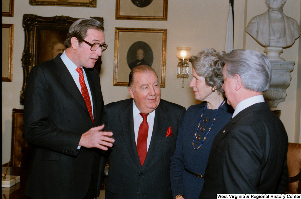 ["Senator John D. (Jay) Rockefeller speaks with Senator Robert C. Byrd and former Senator Jennings Randolph after the Senate Swearing-In Ceremony."]%