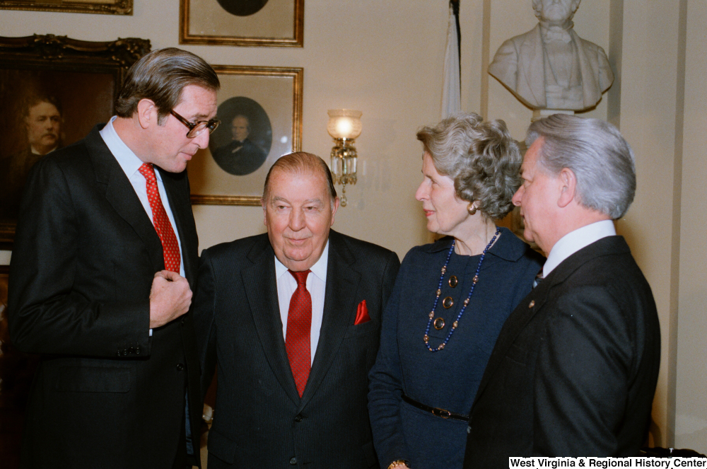 ["Following the Senate Swearing-In Ceremony, Senator John D. (Jay) Rockefeller speaks with former Senator Jennings Randolph and Senator Robert C. Byrd."]%