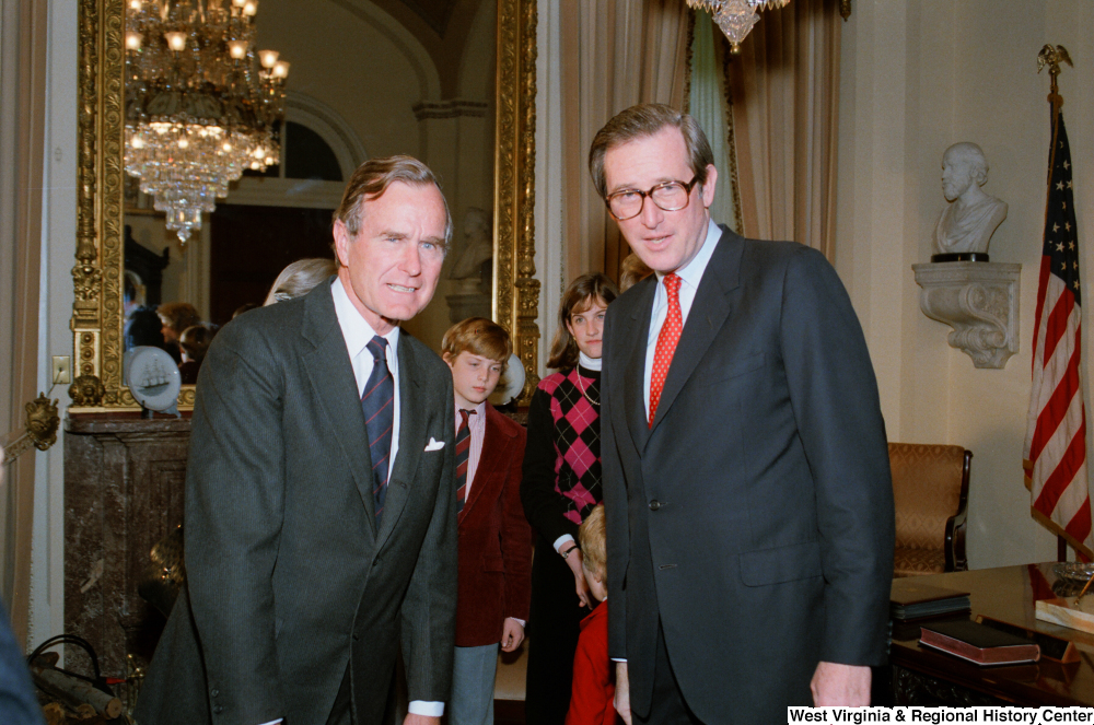 ["Vice President George H. W. Bush stands with Senator John D. (Jay) Rockefeller following the Senate Swearing-In Ceremony."]%
