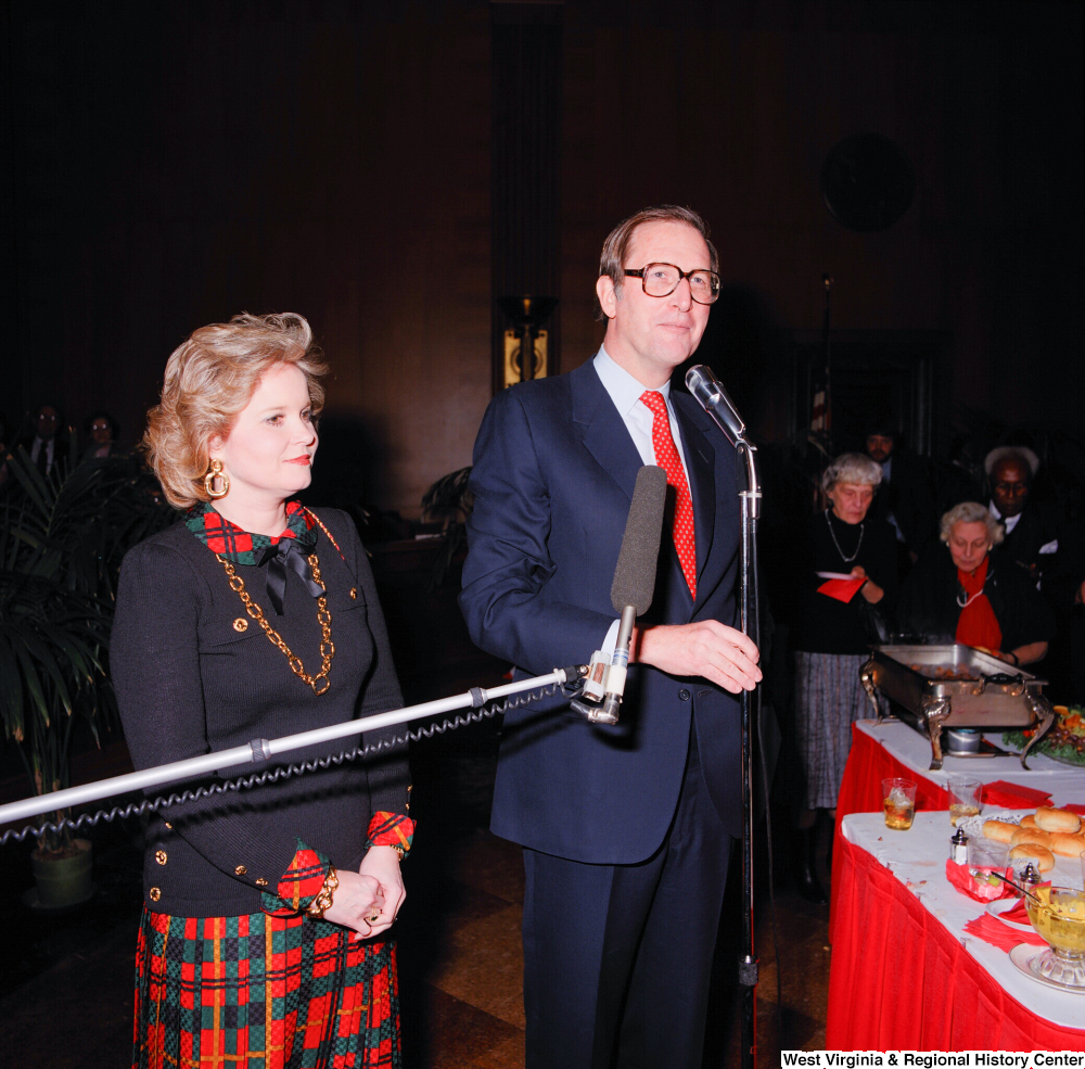 ["Accompanied by his wife Sharon, Senator John D. (Jay) Rockefeller addresses the unidentified attendees of a banquet event following his Senate Swearing-In Ceremony."]%