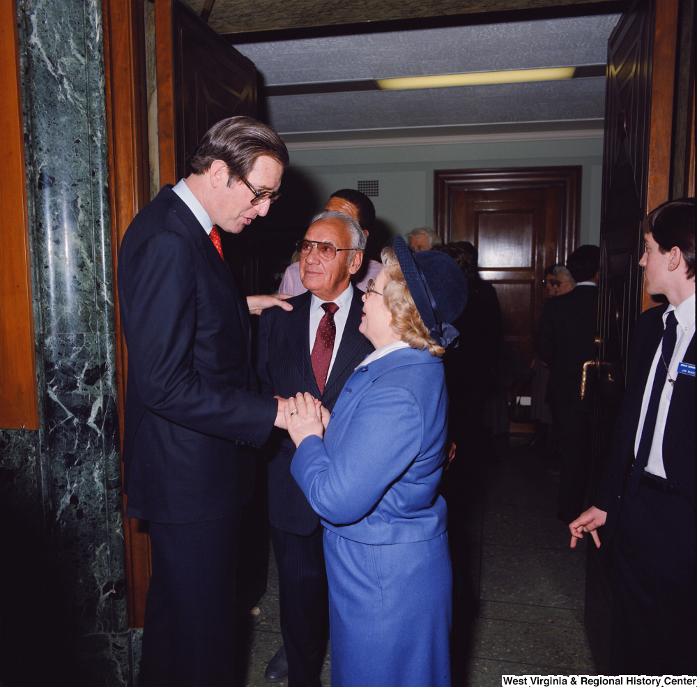 ["After the Senate Swearing-In Ceremony, Senator John D. (Jay) Rockefeller shakes hands with unidentified supporters."]%