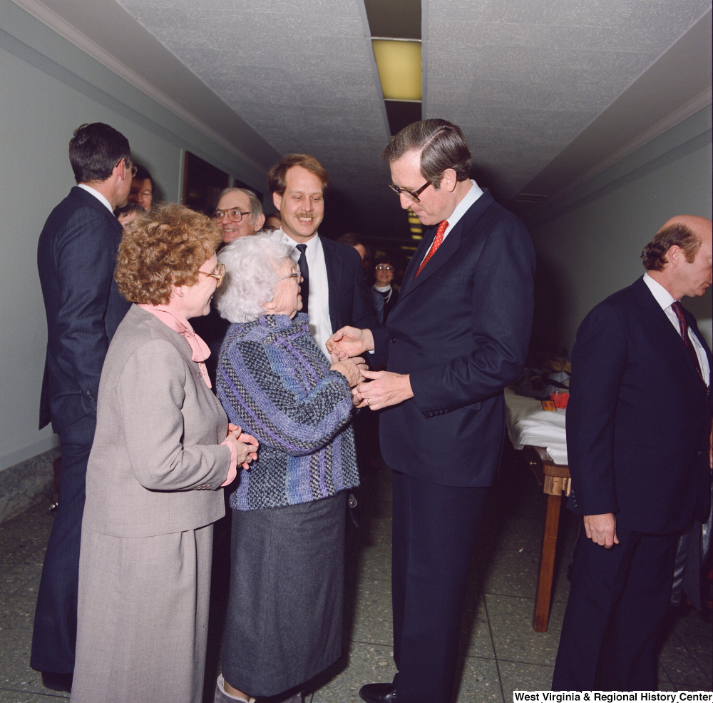 ["Unidentified supporters speak with Senator John D. (Jay) Rockefeller after the Senate Swearing-In Ceremony."]%