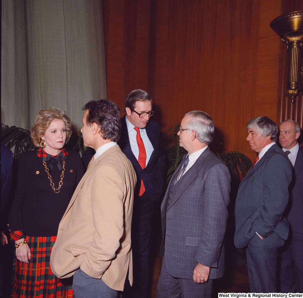 ["After his Swearing-In Ceremony, Senator John D. (Jay) Rockefeller and his wife Sharon are greeted by unidentified supporters."]%