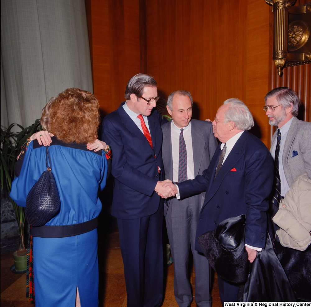 ["Senator John D. (Jay) Rockefeller shakes hands with an unidentified supporter at the Senate Swearing-In Ceremony."]%
