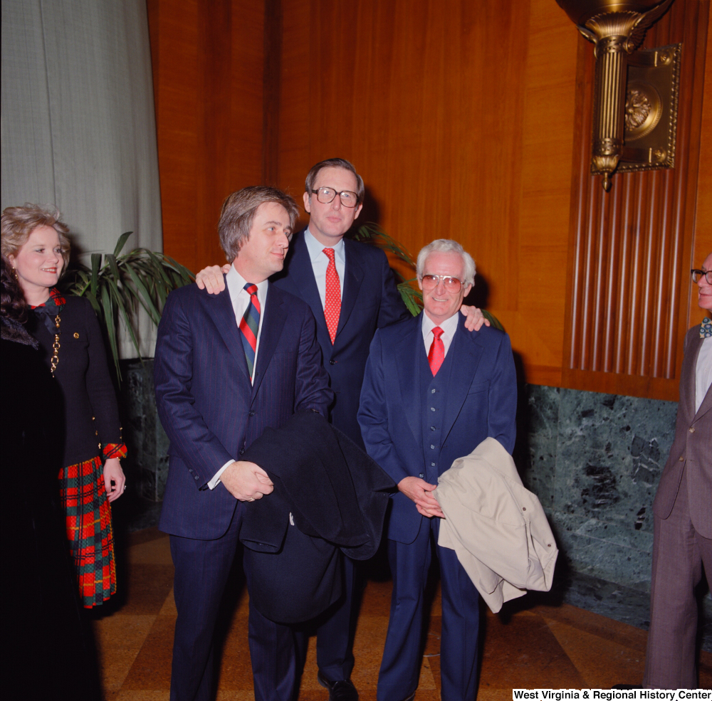 ["Senator John D. (Jay) Rockefeller and two unidentified supporters pose for a photograph at the Senate Swearing-In Ceremony."]%