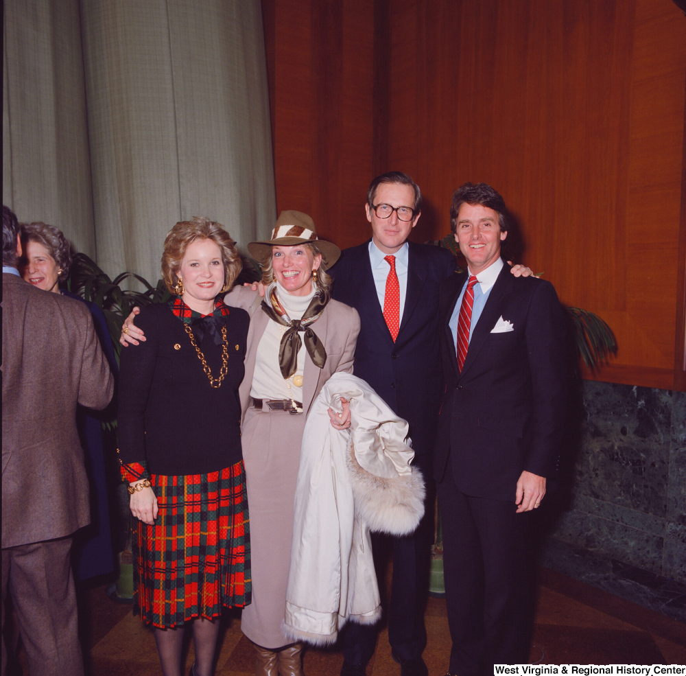 ["Senator John D. (Jay) Rockefeller, his wife Sharon, and two unidentified supporters pose for a photo at the Senate Swearing-In Ceremony."]%