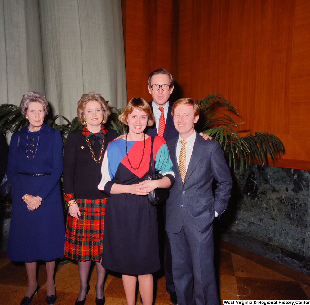 ["Two unidentified supporters pose for a photograph with Senator John D. (Jay) Rockefeller and his wife Sharon after the Senate Swearing-In Ceremony."]%