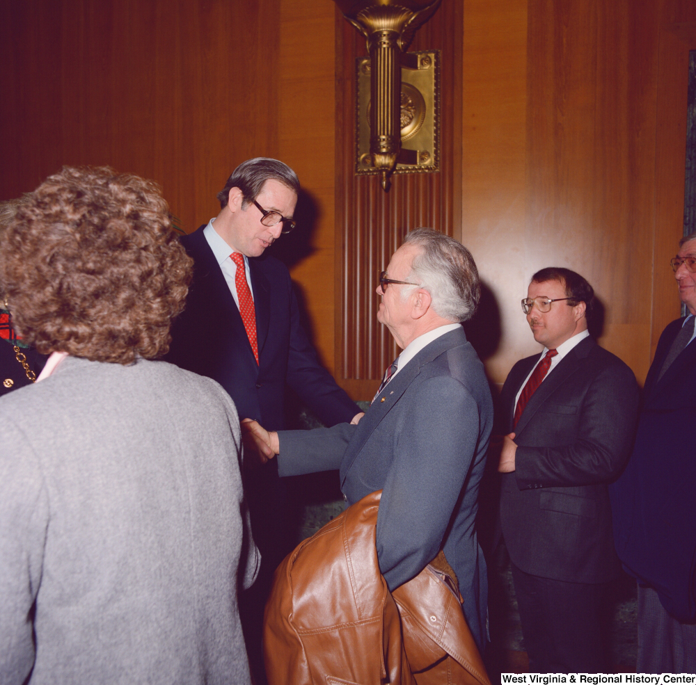 ["Senator John D. (Jay) Rockefeller shakes the hand of an unidentified supporter at the Senate Swearing-In Ceremony."]%