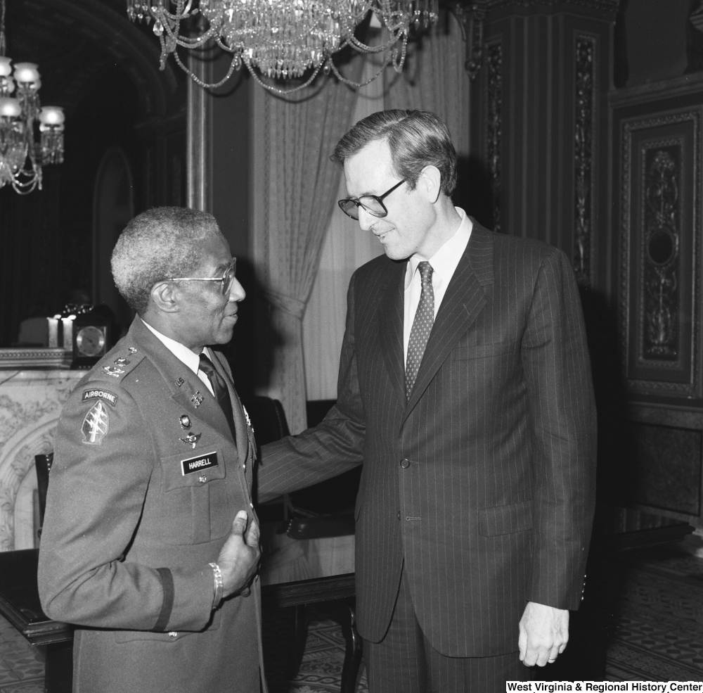 ["Senator John D. (Jay) Rockefeller speaks with Major General Ernest Harrell in one of the Senate buildings."]%