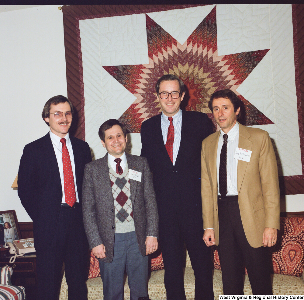 ["This color photograph shows Senator John D. (Jay) Rockefeller posing for a photograph with representatives from the West Virginia Family Resource Network."]%