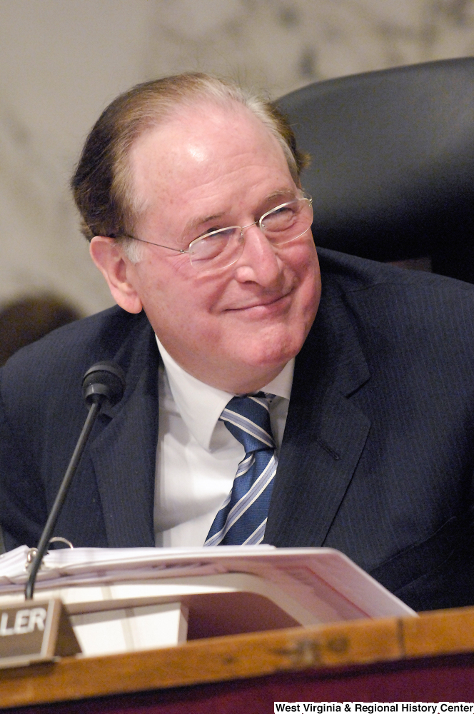 ["Senator John D. (Jay) Rockefeller smiles during a Senate intelligence committee hearing."]%