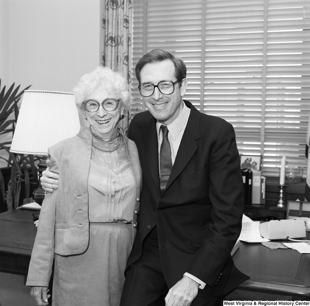 ["Senator John D. (Jay) Rockefeller and a woman from the Education School Budget Group hug and pose for a photograph in his office."]%