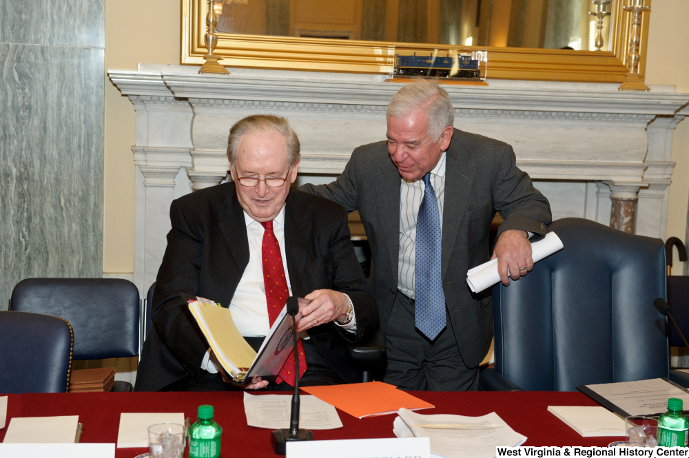 ["Senator John D. (Jay) Rockefeller and Congressman Nick Rahall talk before a Commerce Committee event."]%