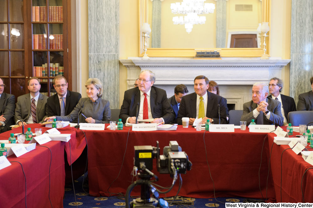 ["Senators John D. (Jay) Rockefeller and Kay Hutchison and Congressmen Mica and Rahall sit at a joint Commerce Committee meeting."]%