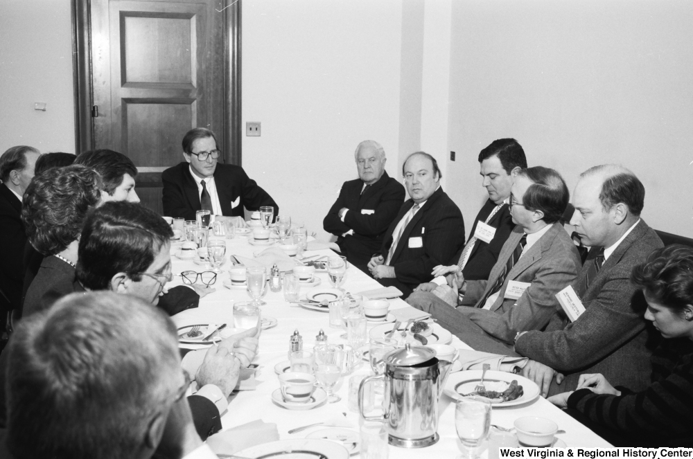 ["Senator John D. (Jay) Rockefeller sits with representatives from hospitals in  West Virginia."]%