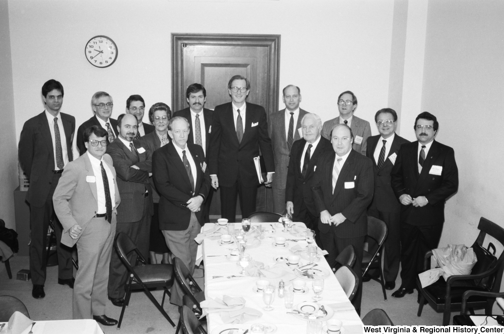 ["Senator John D. (Jay) Rockefeller stands for a photograph with representatives from West Virginia hospitals after a breakfast reception in the Senate."]%