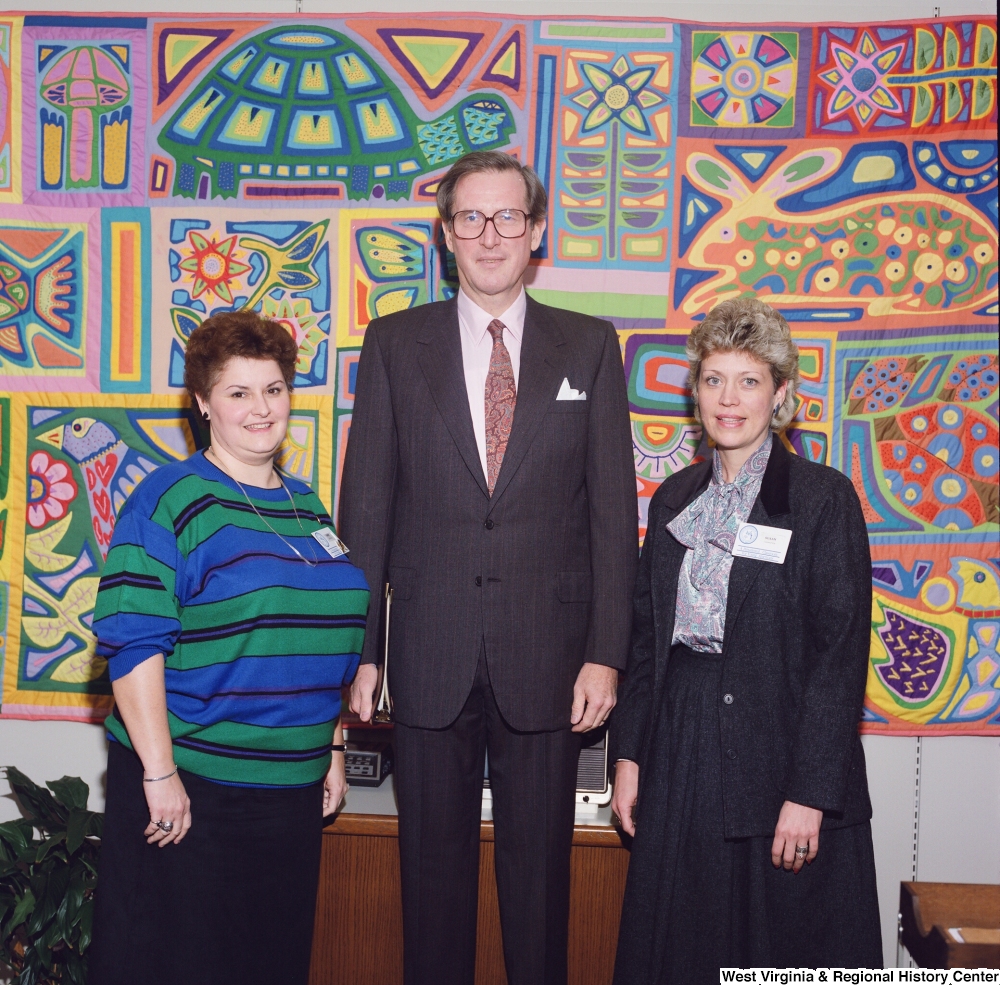 ["Senator John D. (Jay) Rockefeller stands between two participants of the Presidential Classroom for Young Americans."]%