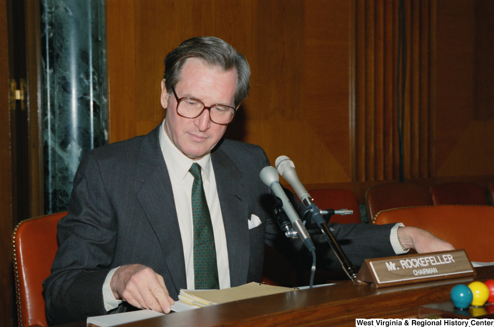 ["Senator John D. (Jay) Rockefeller sits and looks at his notes during a Senate sub-committee hearing that he is chairing."]%