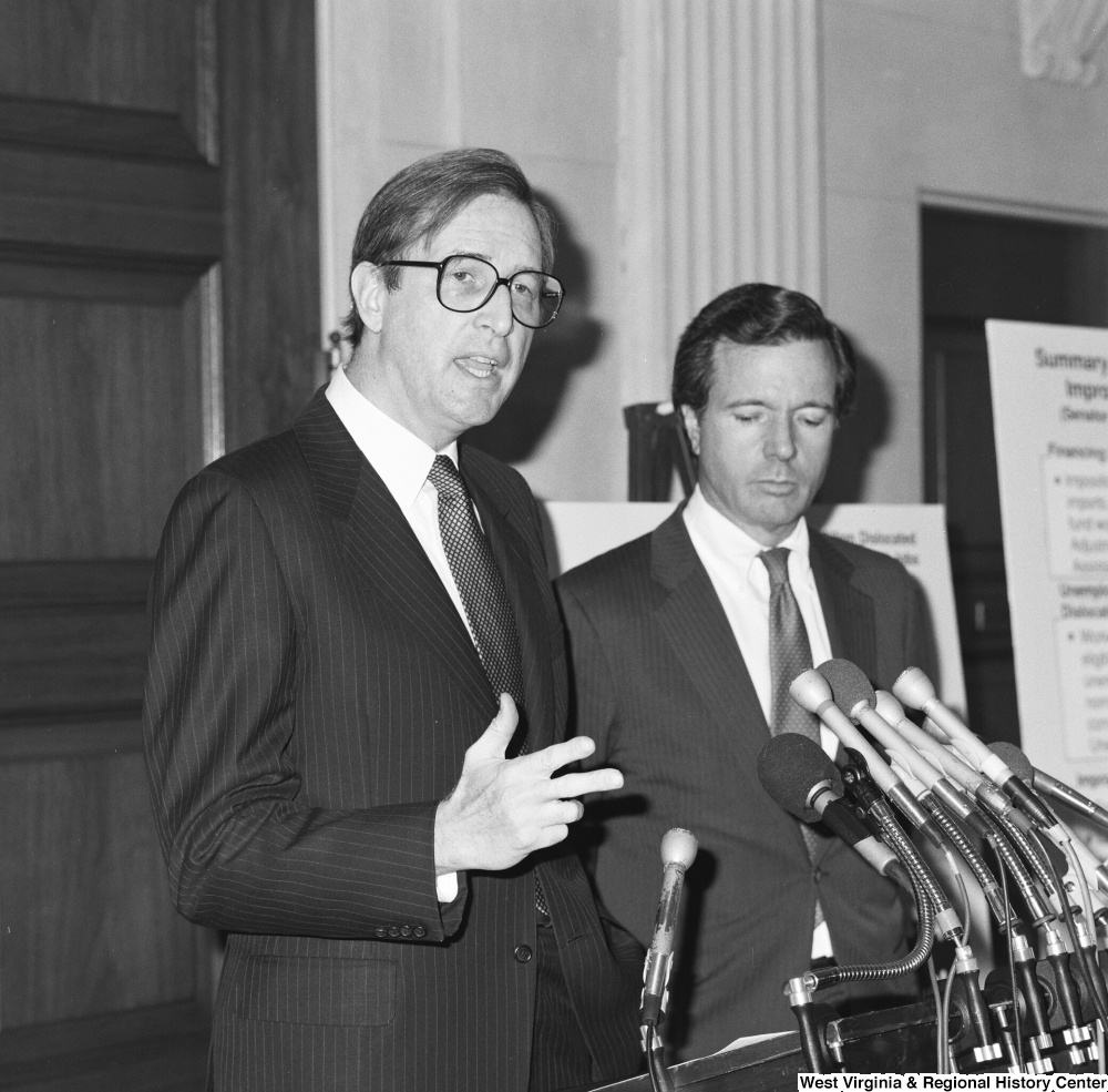 ["Senator H. John Heinz III stands beside Senator John D. (Jay) Rockefeller as he speaks about the Dislocated Workers Improvement Act of 1987 at a press event."]%