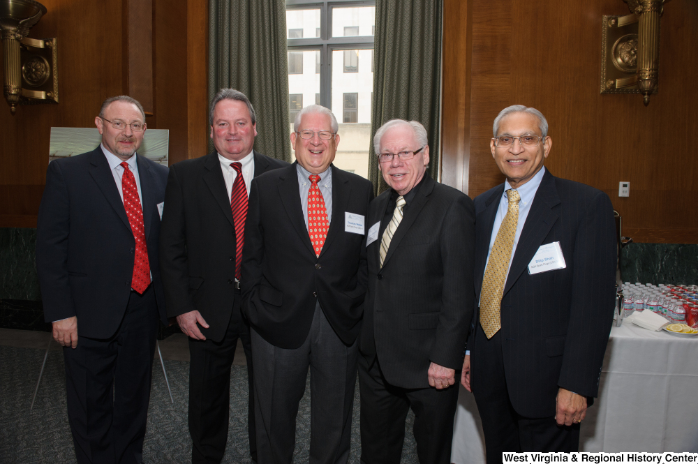 ["Five industry leaders stand together at a Welcome to Washington luncheon event."]%