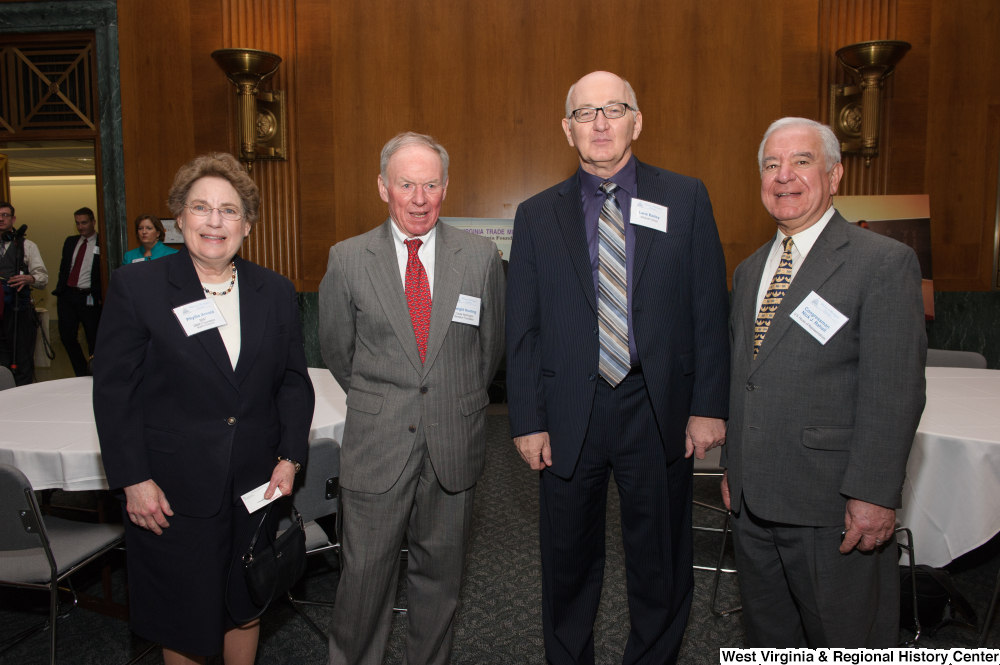 ["Representative Nick Rahall stands with three individuals at a Welcome to Washington luncheon event."]%