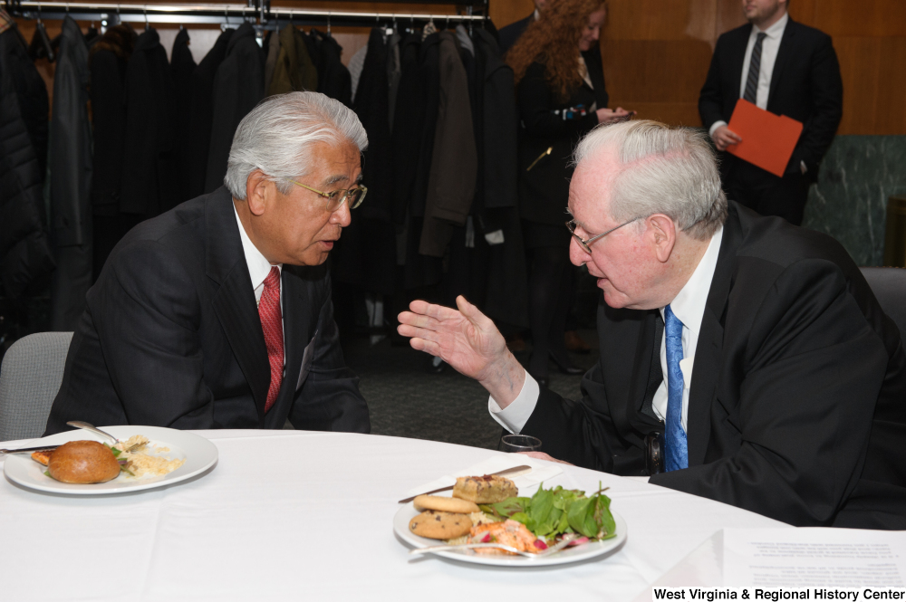 ["Senator John D. (Jay) Rockefeller speaks with an industry leader during a Welcome to Washington luncheon."]%