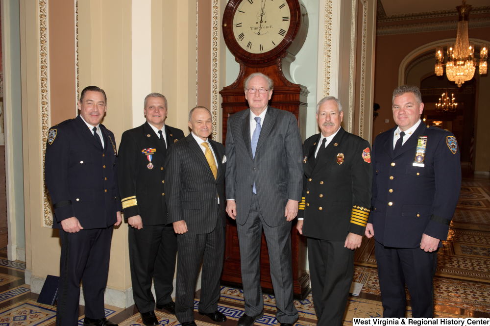 ["Photograph of Senator Rockefeller standing with New York City Police Commissioner Kelly and others before a Commerce Committee hearing."]%