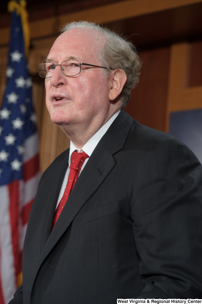 ["Senator John D. (Jay) Rockefeller stands at a Senate press event."]%