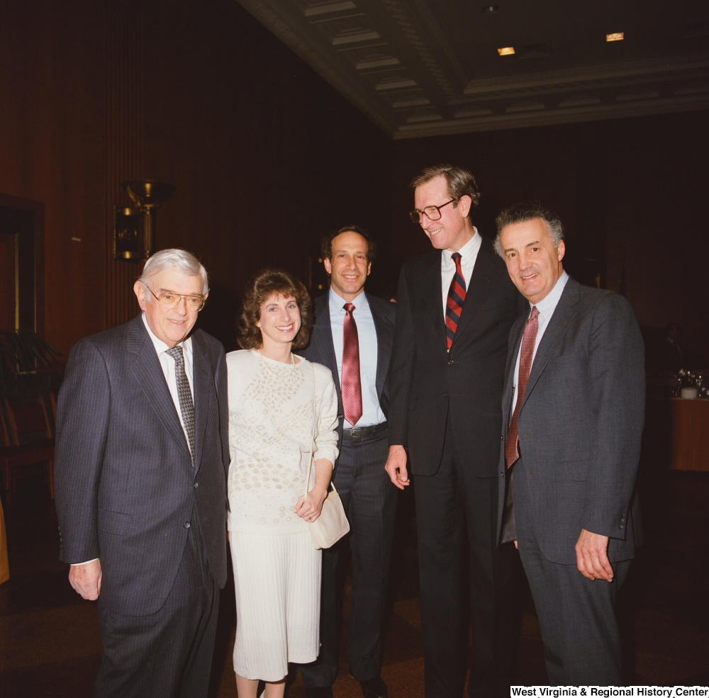 ["Senator John D. (Jay) Rockefeller stands with staff members during an event at the Senate."]%
