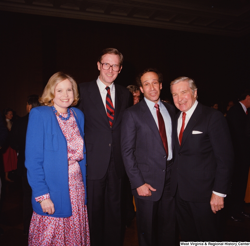 ["Senator John D. (Jay) Rockefeller and Sharon Rockefeller stand with two staff members during a banquet at the Senate."]%