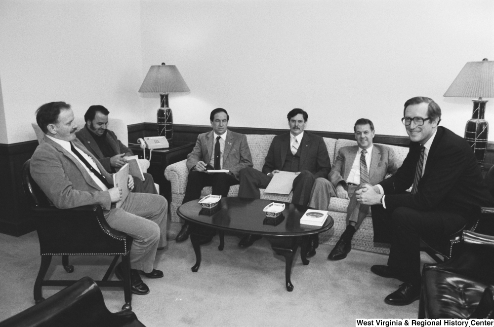 ["An unidentified group of unemployed coal miners meets with Senator John D. (Jay) Rockefeller in his office."]%