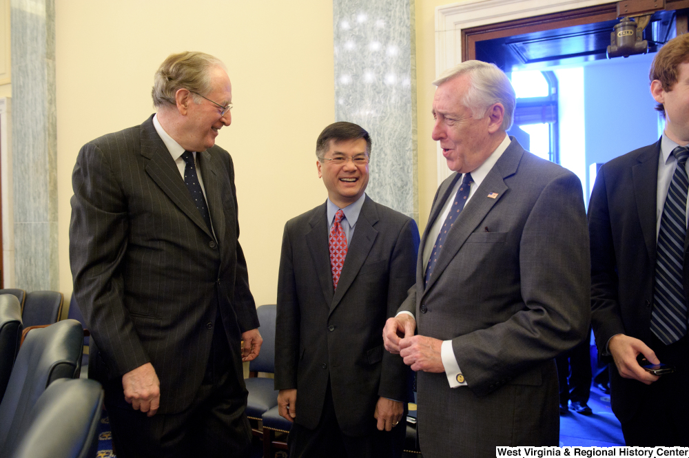 ["Senator John D. (Jay) Rockefeller and Congressman Steny Hoyer laugh outside the Senate Commerce Committee hearing room."]%