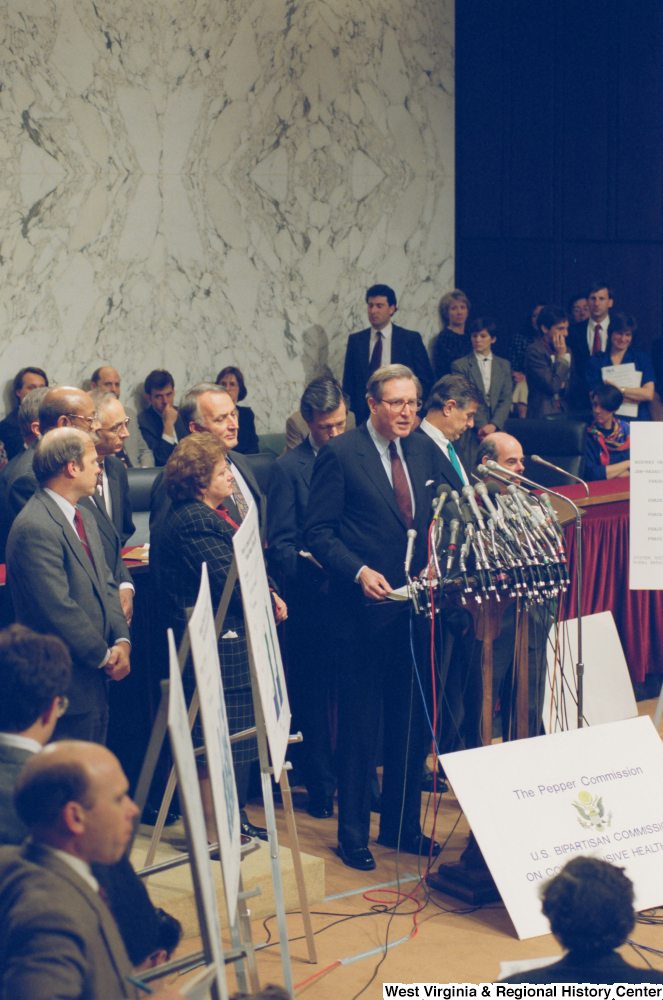 ["Senator John D. (Jay) Rockefeller stands at a Pepper Commission press conference."]%