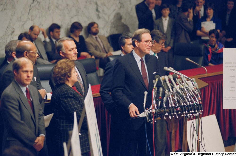 ["Senator John D. (Jay) Rockefeller stands behind the microphones at a press conference for the Pepper Commission."]%