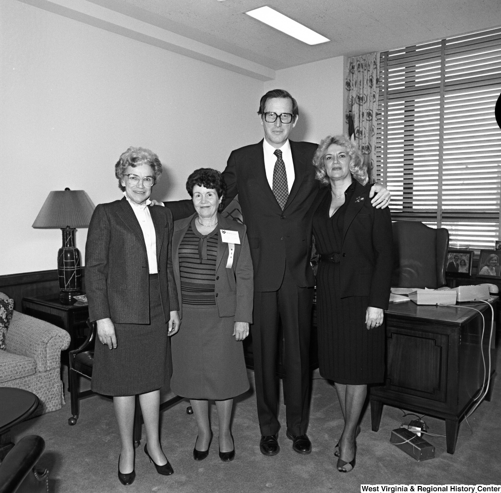 ["Three Marion County, WV officials pose for a photograph with Senator John D. (Jay) Rockefeller in his Washington office."]%