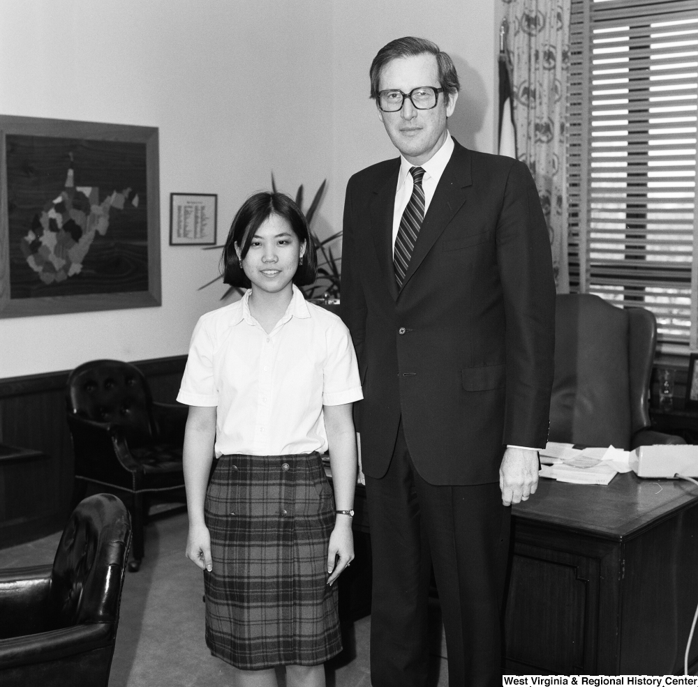 ["Senator John D. (Jay) Rockefeller is photographed with an unidentified individual in his Washington office."]%