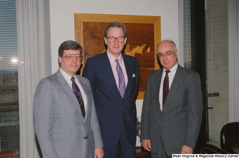 ["Senator John D. (Jay) Rockefeller stands between two representatives of Wheeling-Pittsburgh Steel."]%