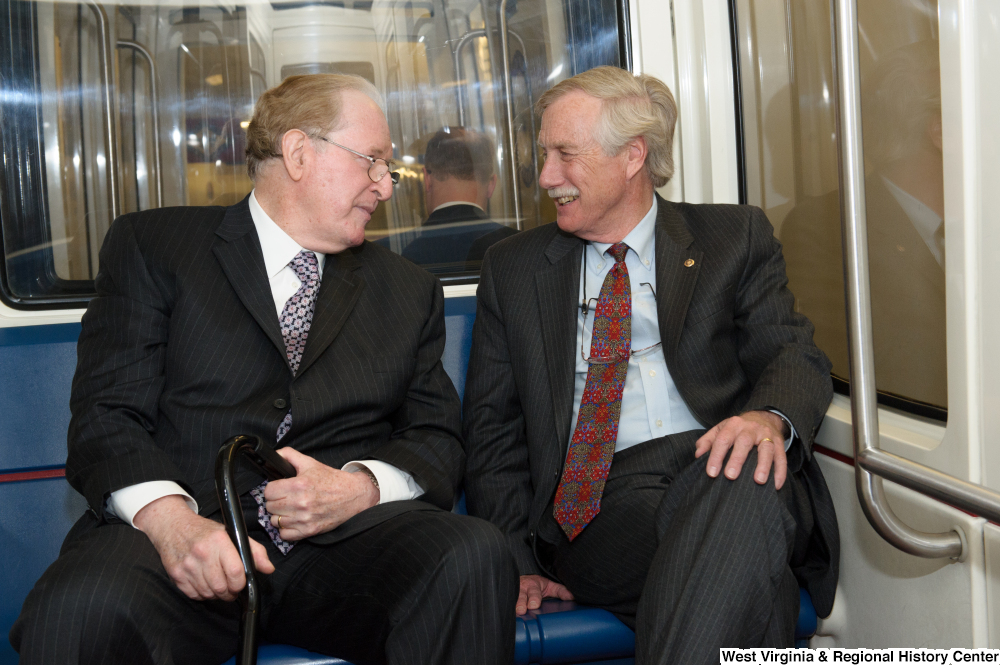 ["Senators John D. (Jay) Rockefeller and Angus King ride the train to the Capitol Building."]%