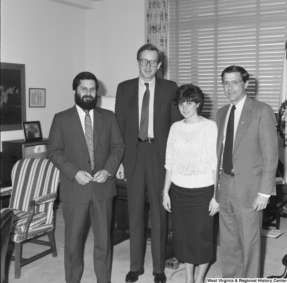 ["Senator John D. (Jay) Rockefeller stands in his office with two doctors from West Virginia and one's daughter."]%