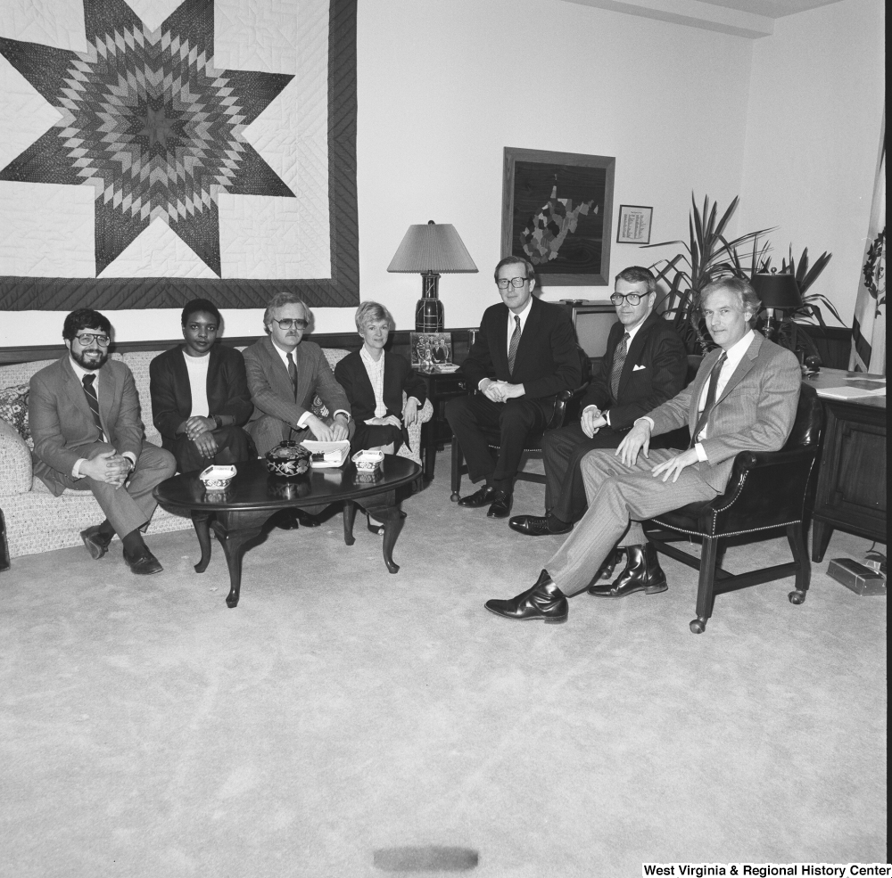 ["Senator John D. (Jay) Rockefeller sits with members of Capitol Theater Restoration in his Washington office."]%