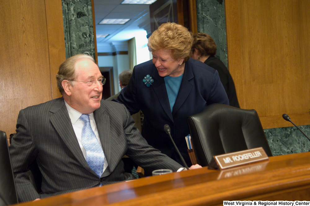 ["Senators John D. (Jay) Rockefeller and Debbie Stabenow laugh together before a Senate Finance Committee hearing."]%