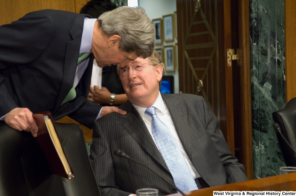 ["Senators John D. (Jay) Rockefeller and John Kerry speak before a Senate Finance Committee hearing."]%